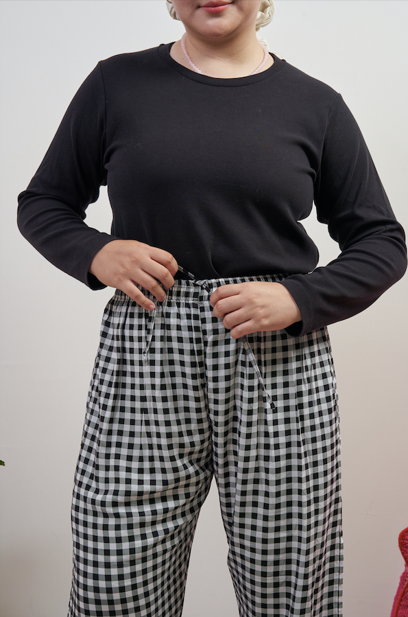 Close-up of the waist area of Flutter Flair Pants in Noir Blanc, featuring adjustable drawstring waist and black & white gingham pattern